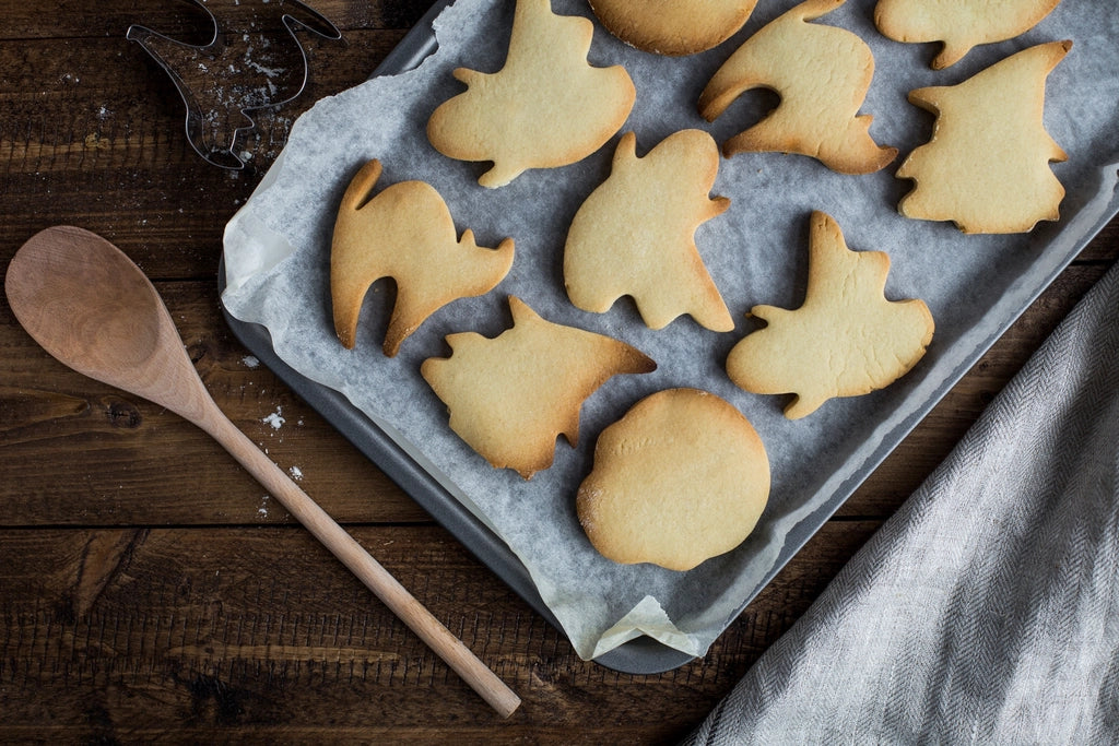 Halloween cookies shaped like cats and ghosts