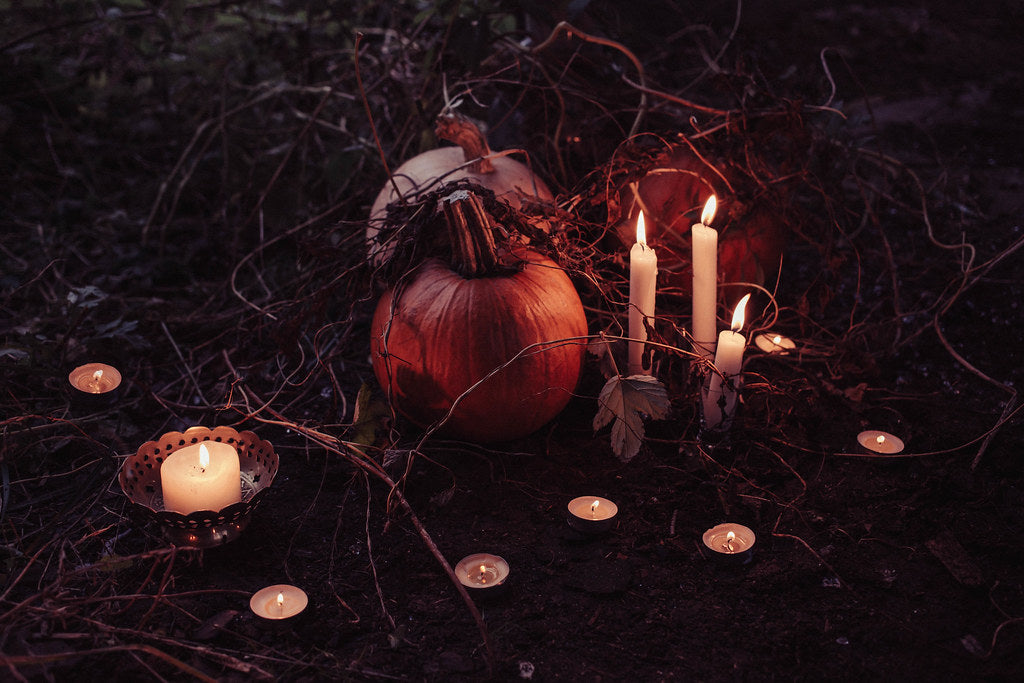 Pumpkins and candles at dusk
